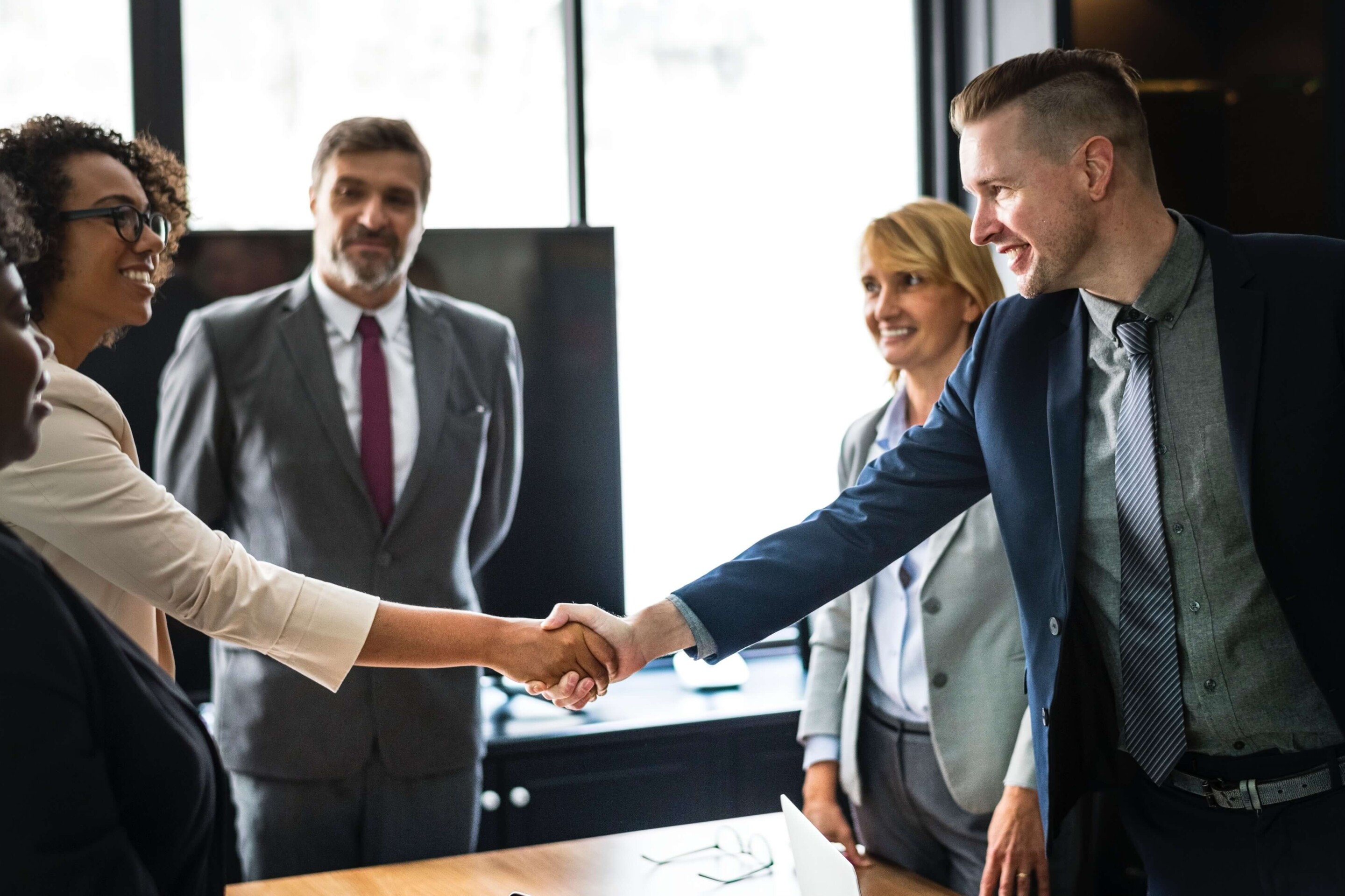 insurance agent shaking hands with a customer