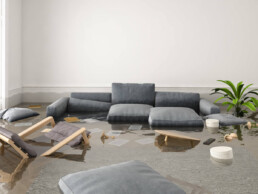 flooded office with chairs, couches, and tables halfway under water