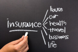 types of insurance written on chalkboard